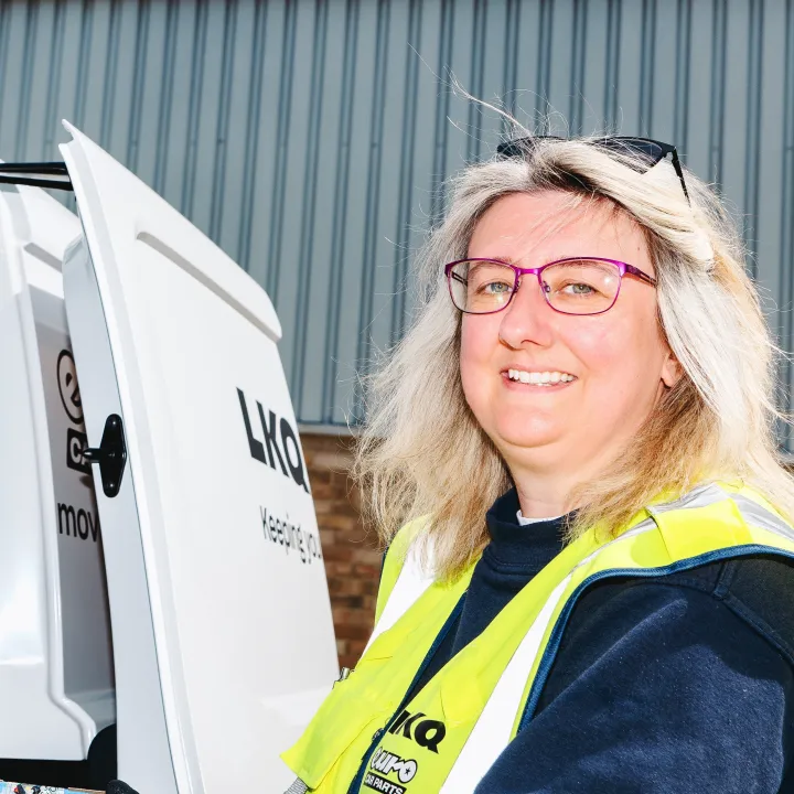 LKQ Euro Car Parts colleague beside delivery van